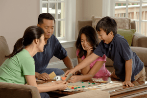 Family playing educational board game